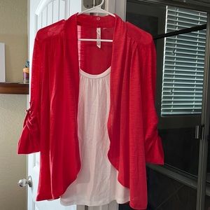 Coral color shirt with sweater attached. Very good condition